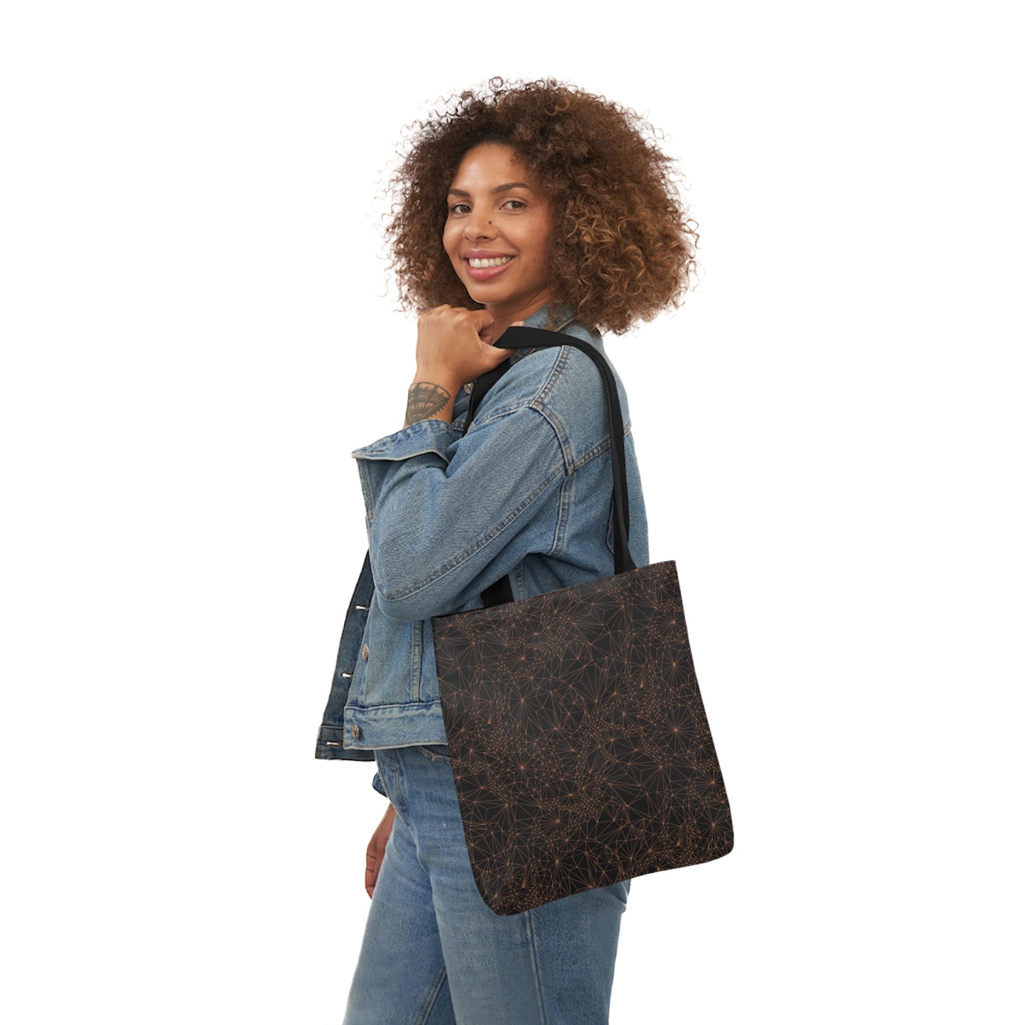 A woman carrying the Tri-Mesh Geometric by Michelle Penland Dodson, Canvas Tote Bag on her shoulder. 13x13