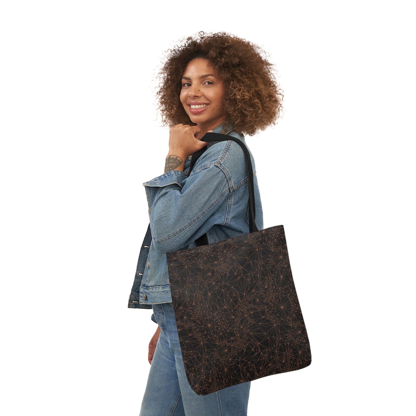 A woman carrying the Tri-Mesh Geometric by Michelle Penland Dodson, Canvas Tote Bag on her shoulder. 8x18