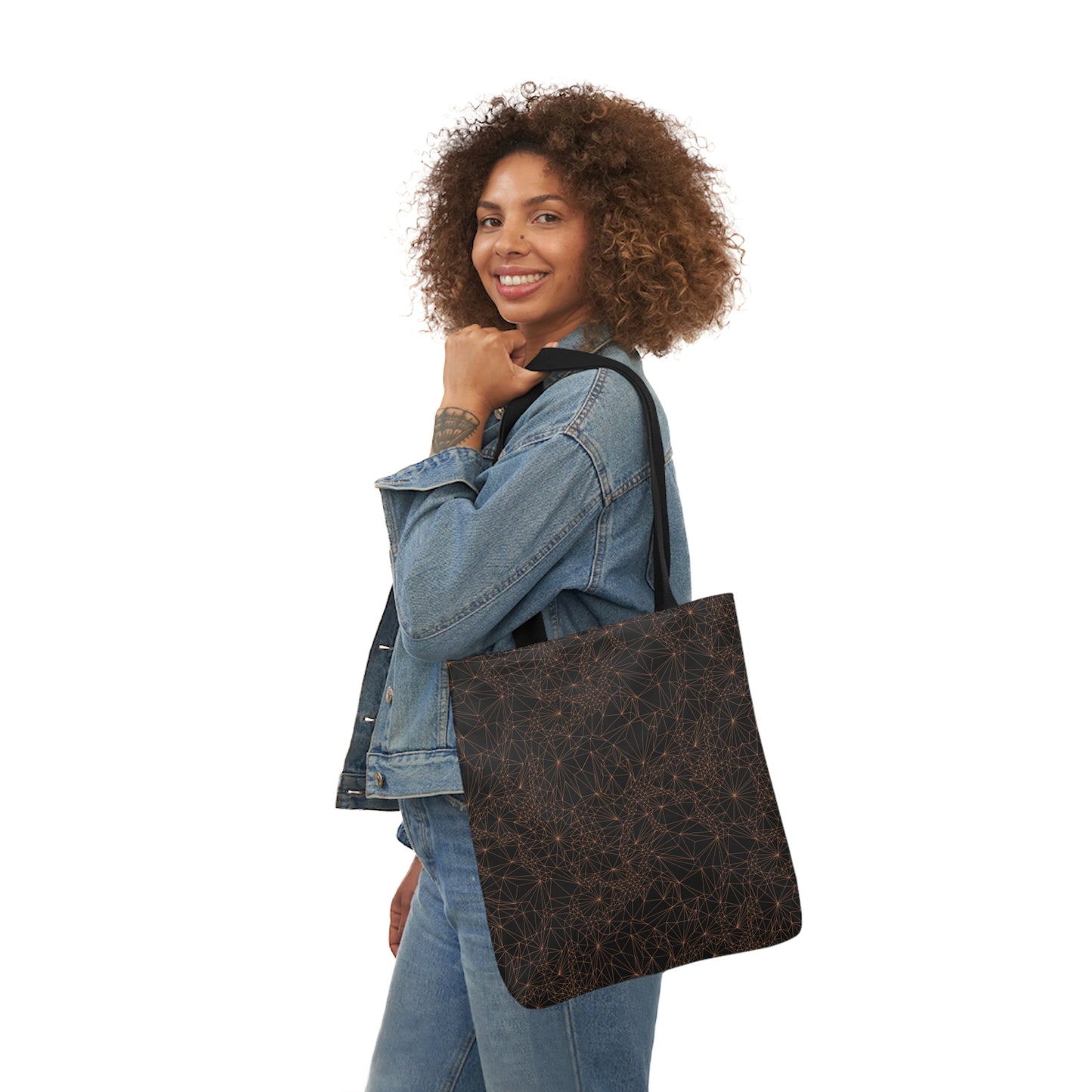 A woman carrying the Tri-Mesh Geometric by Michelle Penland Dodson, Canvas Tote Bag on her shoulder. 16x16