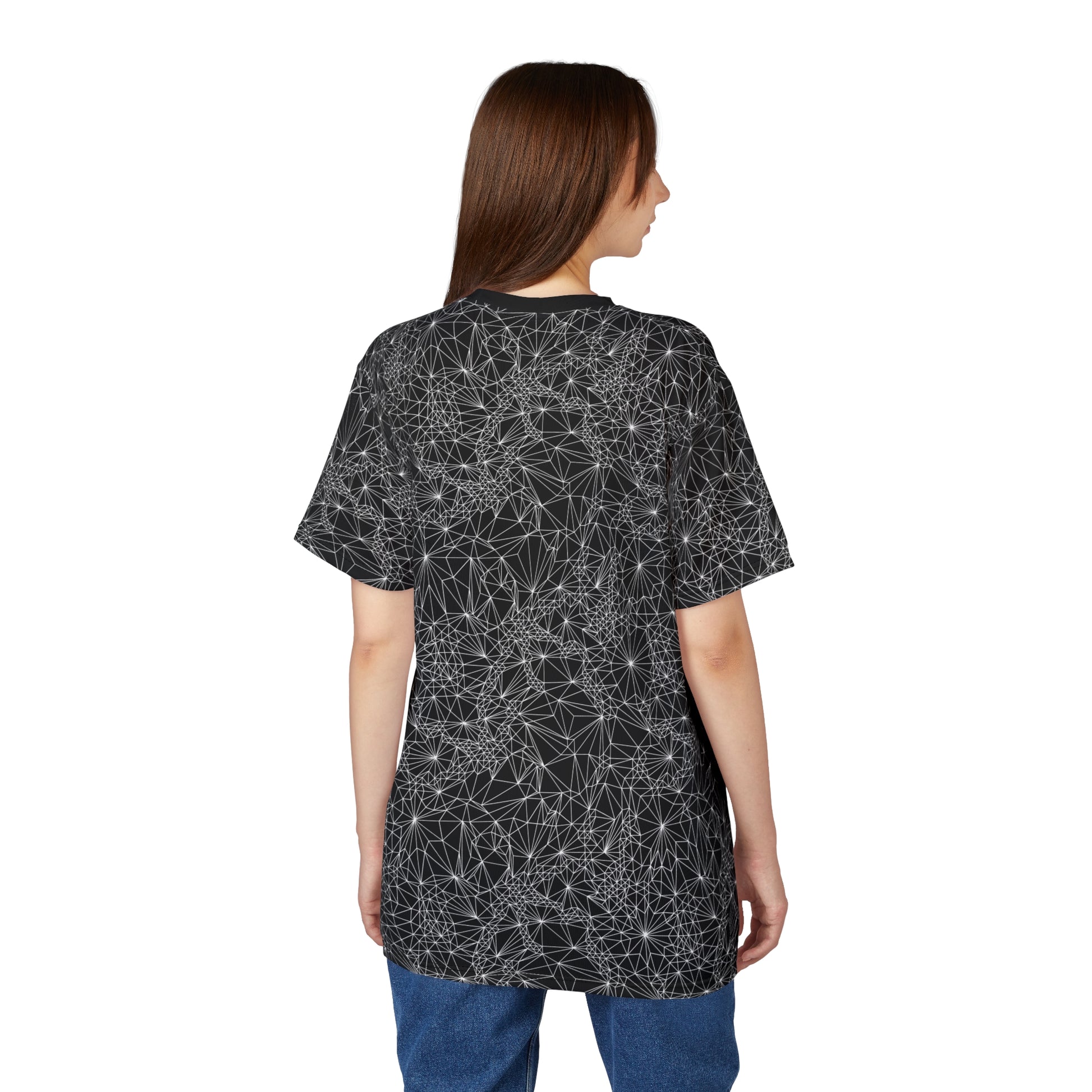 Back of woman wearing Black and White Tri-Geometric t-shirt paired with jeans